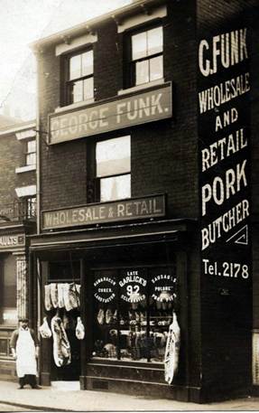 George Funk of Belsenberg in front of his butcher shop in Sheffield that displayed his name in huge letters.