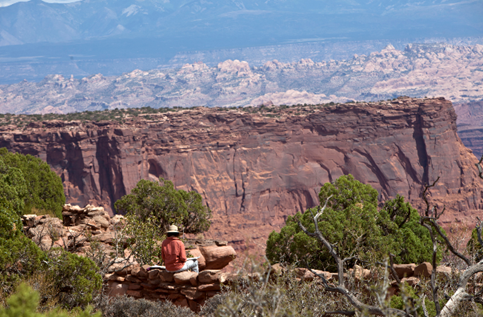 Figure 7. Author drawing at Deadhorse Point. Photo courtesy of Donna Barry.